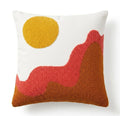 Decorative pillow with abstract shapes in yellow, red, and brown on a white background