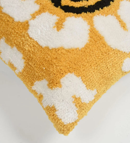Close-up of a textured yellow and white patterned rug.